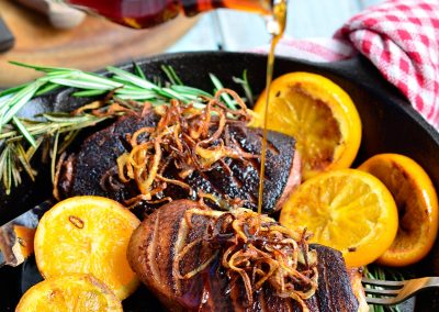 Pan Seared Duck with Orange and Rosemary, Served with Crispy Shallots and Maple Gastrique